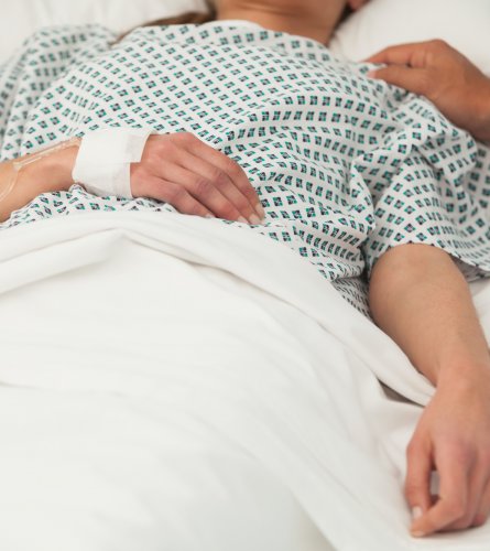 Old lady lying sick in bed